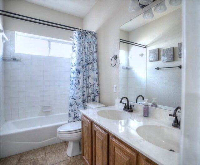 4209 N Sunflower Ln, Temple, TX 76502 - bathroom featuring shower / bath combination with curtain, toilet, double vanity, and tile patterned flooring