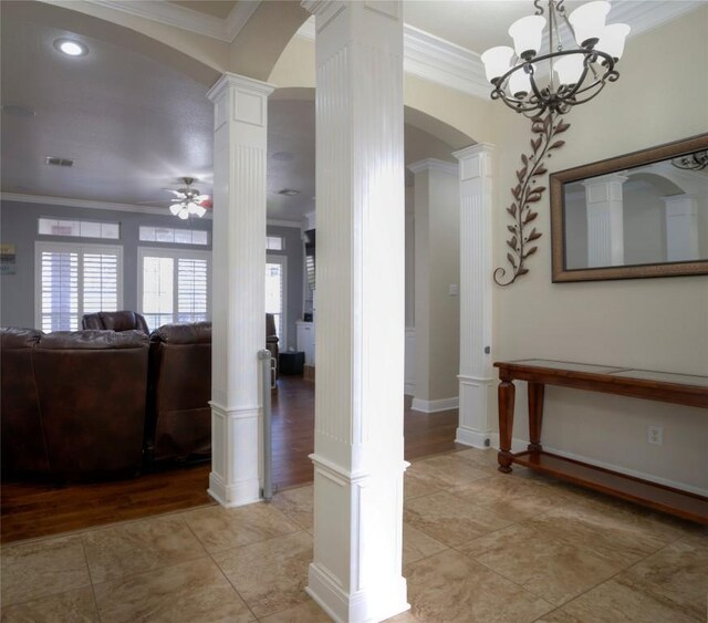 4209 N Sunflower Ln, Temple, TX 76502 - corridor with ornate columns, ornamental molding, arched walkways, a chandelier, and light tile patterned floors