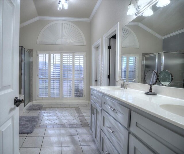 4209 N Sunflower Ln, Temple, TX 76502 - full bath with lofted ceiling, tile patterned flooring, double vanity, a stall shower, and crown molding