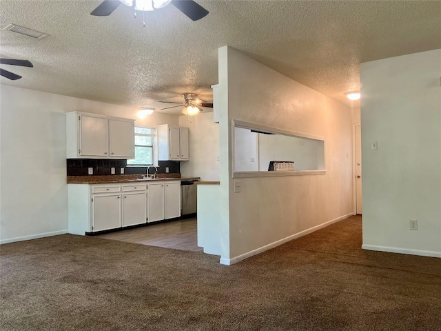 kitchen with dark carpet, ceiling fan, visible vents, and stainless steel dishwasher
