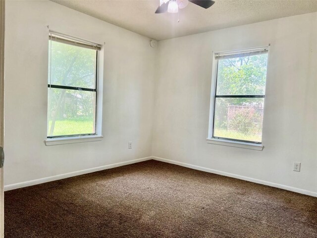 302 Harris St, Smithville, TX 78957 - spare room featuring carpet floors, ceiling fan, and baseboards