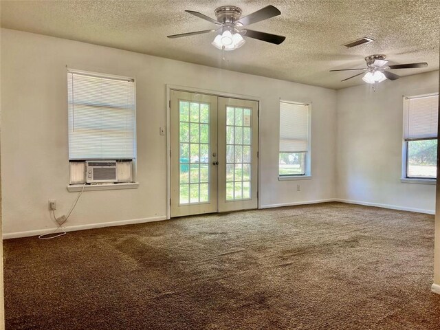 302 Harris St, Smithville, TX 78957 - carpeted spare room featuring ceiling fan, cooling unit, a textured ceiling, french doors, and baseboards
