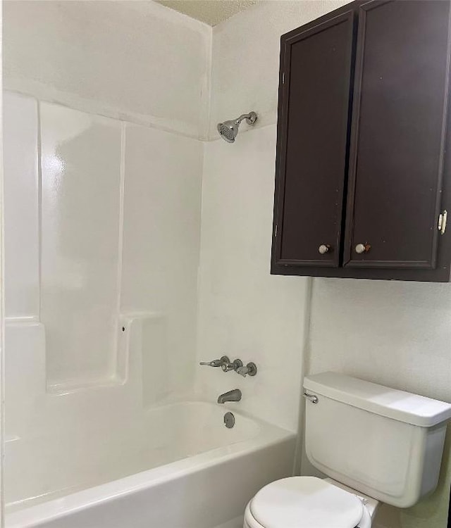 bathroom with toilet and shower / bathtub combination