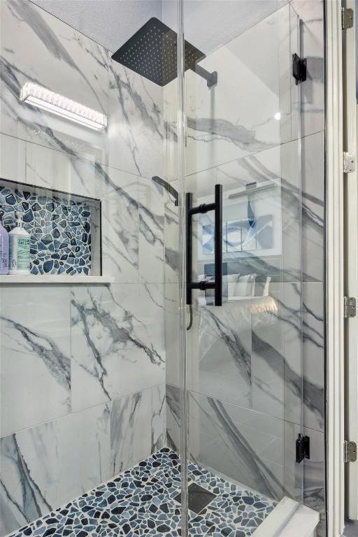 3801 Panther Hall, Leander, TX 78641 - bathroom with a marble finish shower