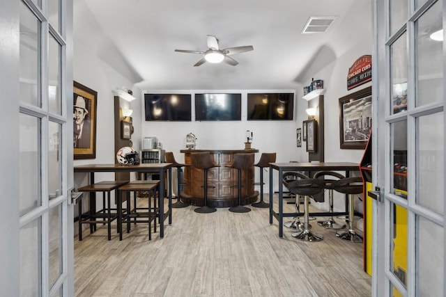 3801 Panther Hall, Leander, TX 78641 - indoor bar with french doors, wood finished floors, and a ceiling fan
