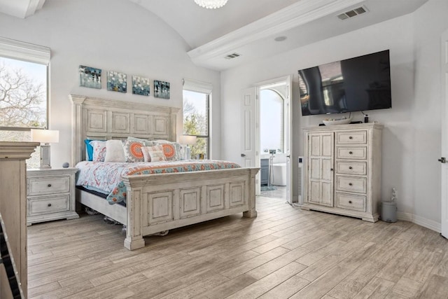 3801 Panther Hall, Leander, TX 78641 - bedroom with vaulted ceiling and light wood-style flooring