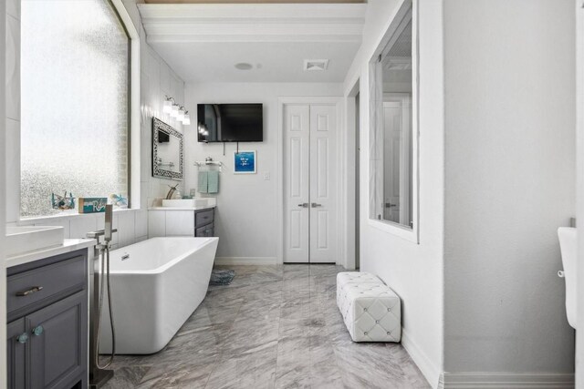 3801 Panther Hall, Leander, TX 78641 - full bath with vanity, a freestanding tub, and marble finish floors