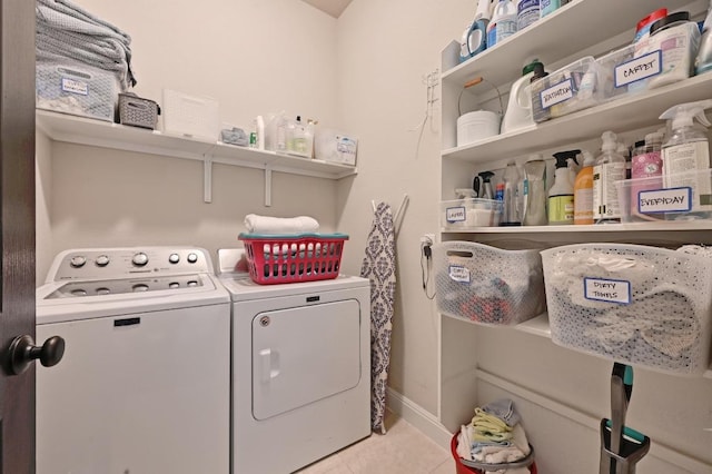1909 Bobbywoods Ln, Manchaca, TX 78652 - laundry area featuring light tile patterned floors, separate washer and dryer, and laundry area