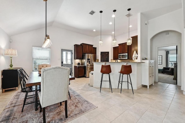 1909 Bobbywoods Ln, Manchaca, TX 78652 - dining space with light tile patterned floors, high vaulted ceiling, recessed lighting, and visible vents