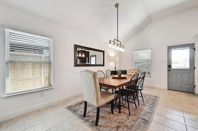 1909 Bobbywoods Ln, Manchaca, TX 78652 - dining space with light tile patterned floors, baseboards, lofted ceiling, and a wealth of natural light