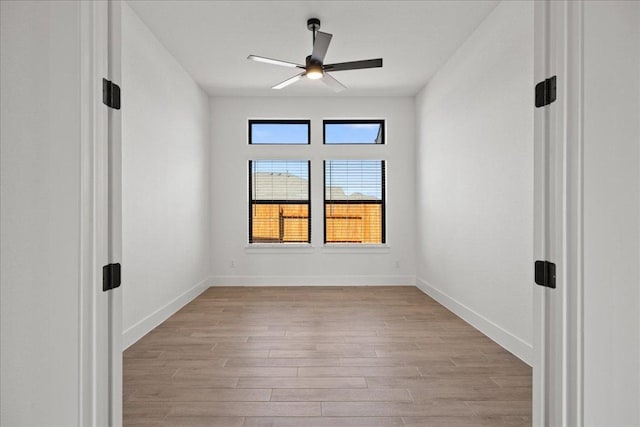 18716 Hopper Ln, Austin, TX 78738 - spare room featuring light wood-type flooring, baseboards, and a ceiling fan