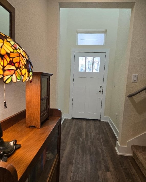 1717 Roseburg Dr, Austin, TX 78754 - foyer featuring baseboards and dark wood finished floors