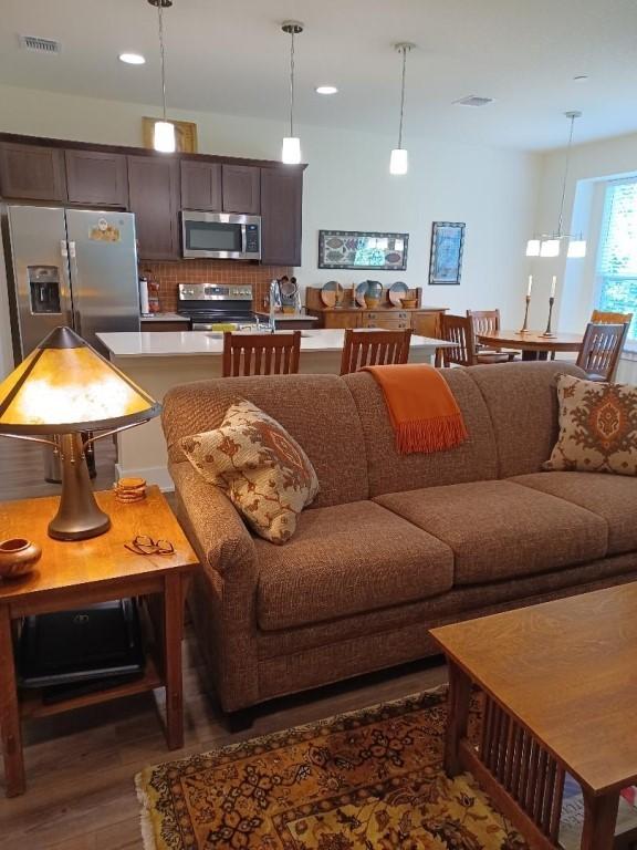 1717 Roseburg Dr, Austin, TX 78754 - living room featuring recessed lighting, dark wood-style floors, and visible vents