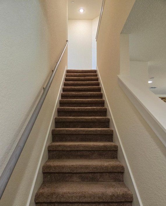 1717 Roseburg Dr, Austin, TX 78754 - staircase with recessed lighting