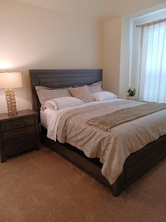 1717 Roseburg Dr, Austin, TX 78754 - bedroom featuring light colored carpet