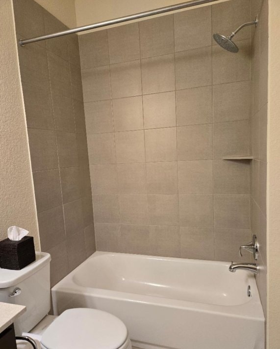 1717 Roseburg Dr, Austin, TX 78754 - full bath with tub / shower combination, toilet, and vanity