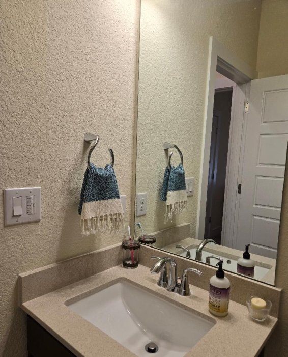1717 Roseburg Dr, Austin, TX 78754 - bathroom with vanity and a textured wall