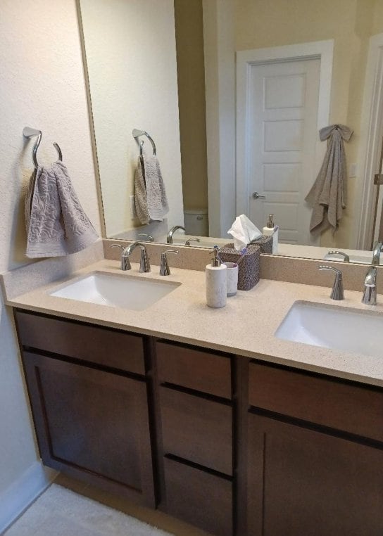 1717 Roseburg Dr, Austin, TX 78754 - full bathroom with double vanity, a sink, and tile patterned flooring
