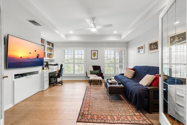 2807 Round Table Rd, Austin, TX 78746 - office space with ornamental molding, light wood-style floors, a tray ceiling, ceiling fan, and built in desk