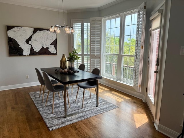 2807 Round Table Rd, Austin, TX 78746 - dining space with wood finished floors, a chandelier, and crown molding