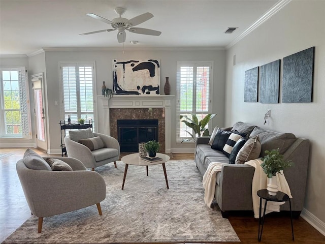 2807 Round Table Rd, Austin, TX 78746 - living area featuring wood finished floors, a ceiling fan, crown molding, and a premium fireplace
