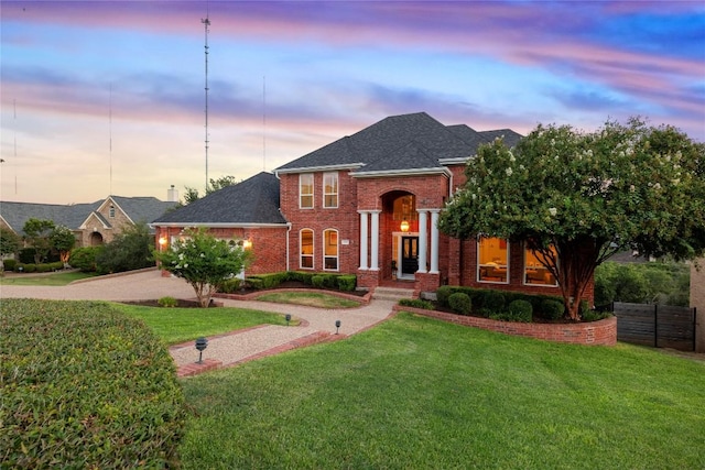2807 Round Table Rd, Austin, TX 78746 - view of front of property featuring brick siding, driveway, a shingled roof, and an attached garage