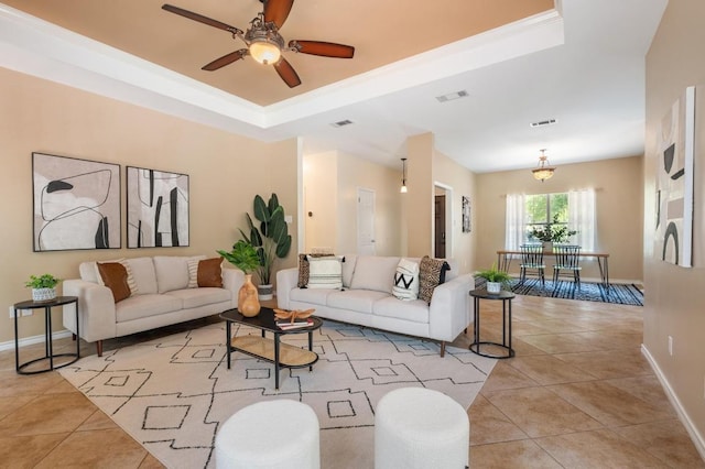 314 Hurst Creek Rd, Lakeway, TX 78734 - living area featuring a tray ceiling, light tile patterned floors, baseboards, and ceiling fan