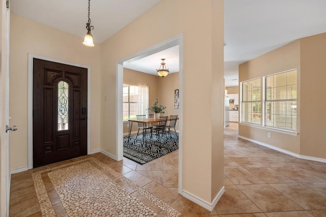 314 Hurst Creek Rd, Lakeway, TX 78734 - entryway with light tile patterned floors and a chandelier