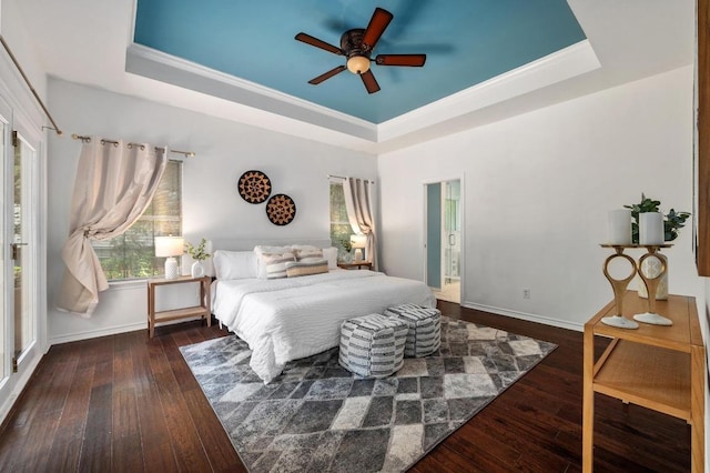 314 Hurst Creek Rd, Lakeway, TX 78734 - bedroom featuring a raised ceiling, wood-type flooring, baseboards, crown molding, and a ceiling fan