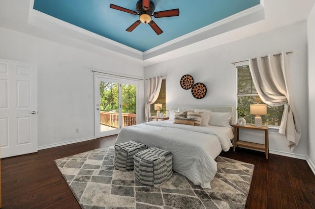 314 Hurst Creek Rd, Lakeway, TX 78734 - bedroom featuring a tray ceiling, access to exterior, wood finished floors, baseboards, and ornamental molding