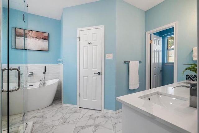 314 Hurst Creek Rd, Lakeway, TX 78734 - bathroom featuring a freestanding bath, marble finish floors, double vanity, and a stall shower