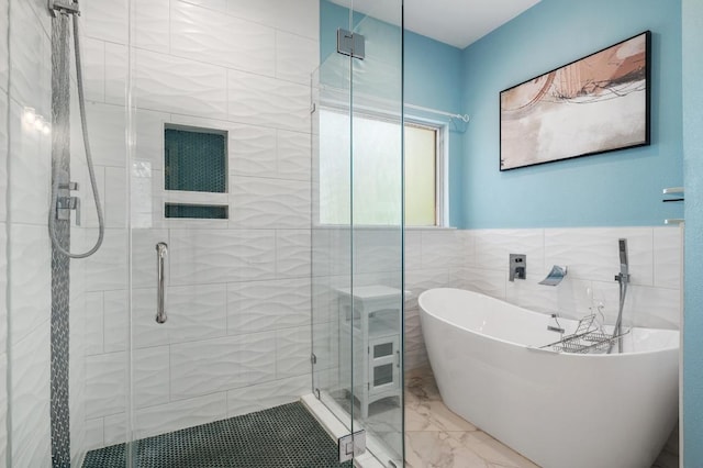 314 Hurst Creek Rd, Lakeway, TX 78734 - full bath with a soaking tub, marble finish flooring, a stall shower, and tile walls