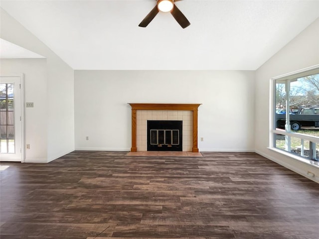 2603 Tracy Trl, Austin, TX 78728 - unfurnished living room with healthy amount of natural light, vaulted ceiling, dark wood finished floors, and ceiling fan