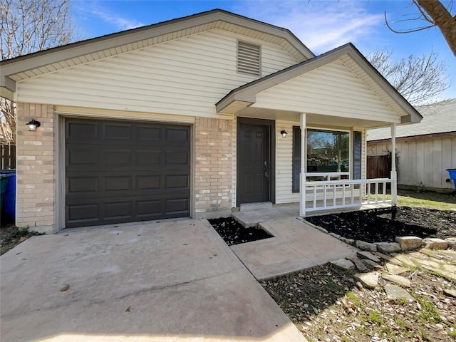2603 Tracy Trl, Austin, TX 78728 - view of front of house featuring brick siding, covered porch, driveway, and an attached garage