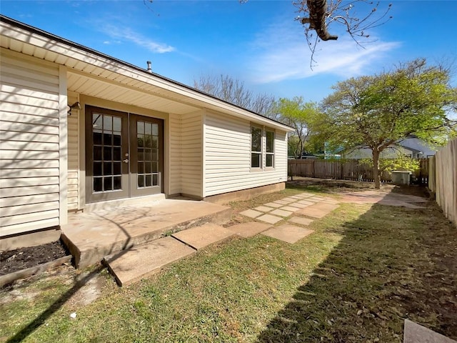 2603 Tracy Trl, Austin, TX 78728 - rear view of house featuring french doors, a fenced backyard, and a patio
