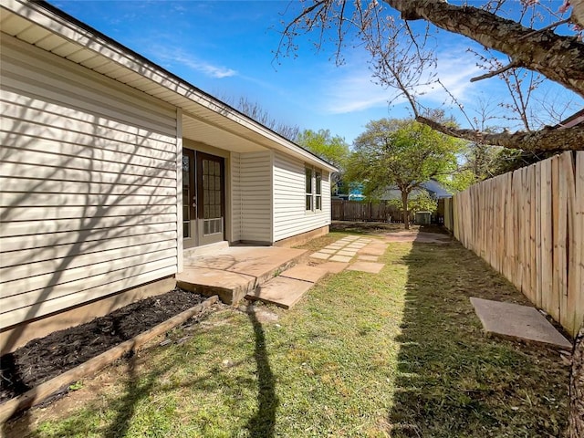 2603 Tracy Trl, Austin, TX 78728 - fenced backyard with a patio
