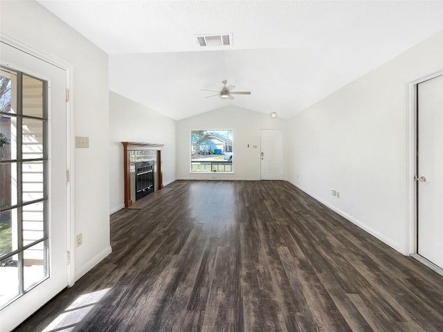 2603 Tracy Trl, Austin, TX 78728 - unfurnished living room with a ceiling fan, dark wood-style floors, lofted ceiling, and a fireplace