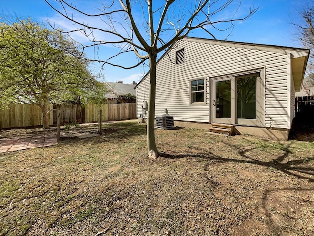 2603 Tracy Trl, Austin, TX 78728 - rear view of house featuring entry steps and a fenced backyard