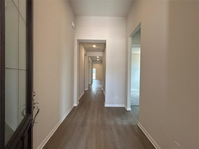 8217 Grenadier Dr, Austin, TX 78738 - hallway featuring dark wood-type flooring and baseboards