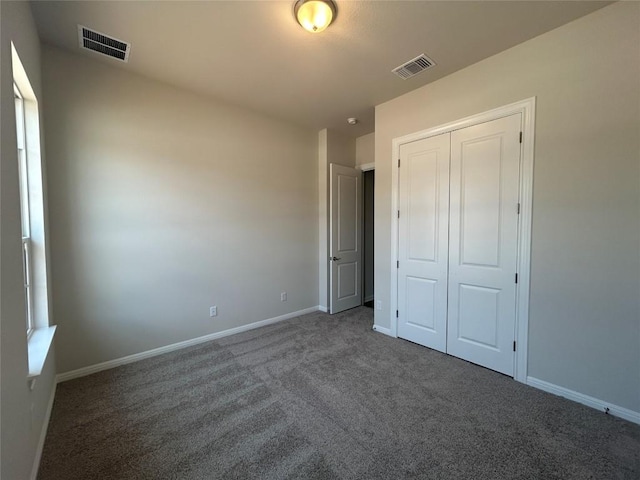 8217 Grenadier Dr, Austin, TX 78738 - unfurnished bedroom featuring carpet, a closet, and baseboards