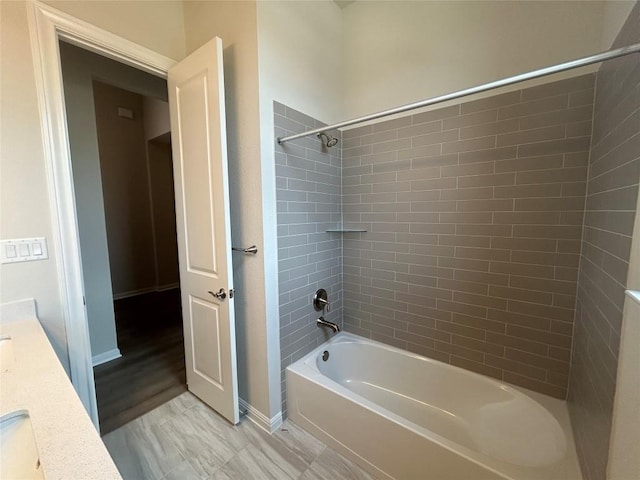 8217 Grenadier Dr, Austin, TX 78738 - full bathroom with shower / bath combination, vanity, and baseboards