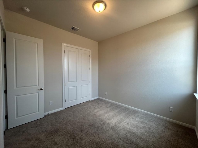 8217 Grenadier Dr, Austin, TX 78738 - unfurnished bedroom with carpet flooring, a closet, and baseboards