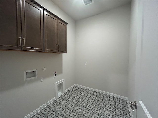8217 Grenadier Dr, Austin, TX 78738 - laundry room featuring electric dryer hookup, cabinet space, washer hookup, tile patterned floors, and hookup for a gas dryer