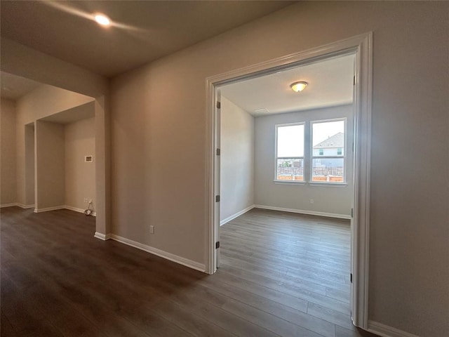 8217 Grenadier Dr, Austin, TX 78738 - empty room featuring dark wood-type flooring and baseboards