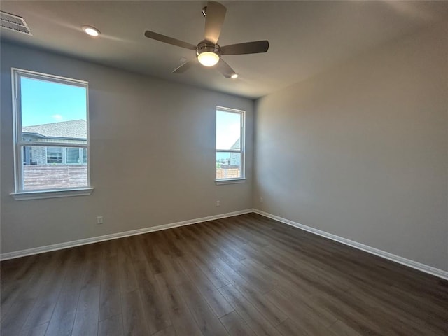 8217 Grenadier Dr, Austin, TX 78738 - empty room with dark wood-type flooring, baseboards, and a ceiling fan
