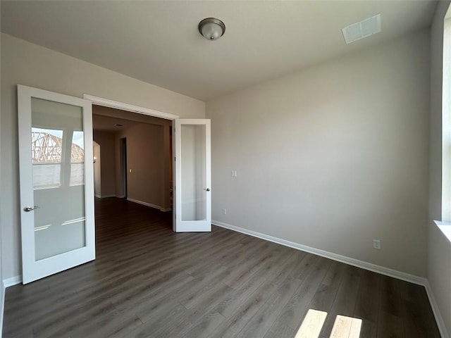 8217 Grenadier Dr, Austin, TX 78738 - empty room featuring french doors and dark wood finished floors