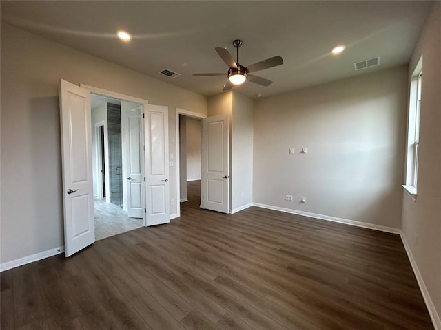 8217 Grenadier Dr, Austin, TX 78738 - unfurnished bedroom with dark wood-type flooring, recessed lighting, and ceiling fan