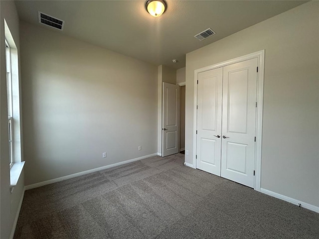 8217 Grenadier Dr, Austin, TX 78738 - unfurnished bedroom featuring carpet flooring and a closet