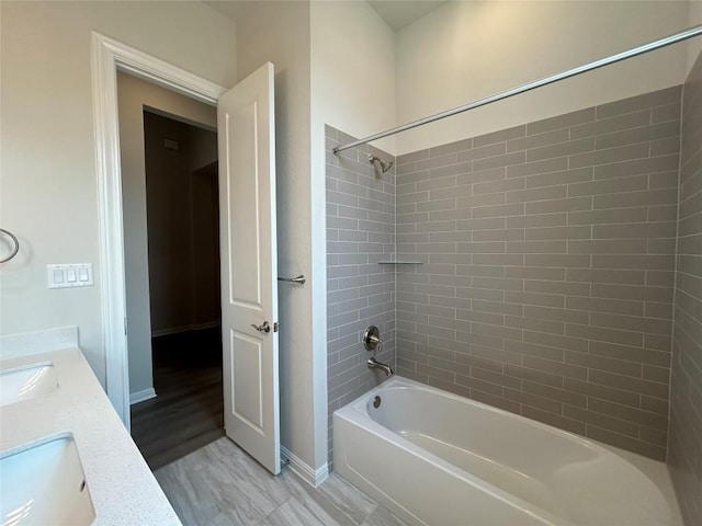 8217 Grenadier Dr, Austin, TX 78738 - full bath featuring bathtub / shower combination, double vanity, and wood finished floors