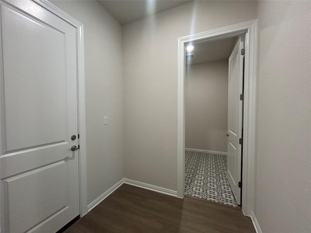 8217 Grenadier Dr, Austin, TX 78738 - hallway with baseboards and dark wood-style flooring